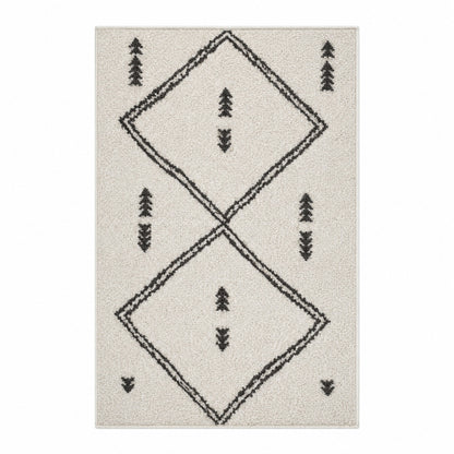 Vue de dessus tapis berbère Beni Ouarain ivoire motifs géométriques noirs