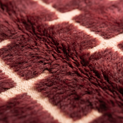 Akkal - Détail macro de la laine et du tissage du tapis Berbère